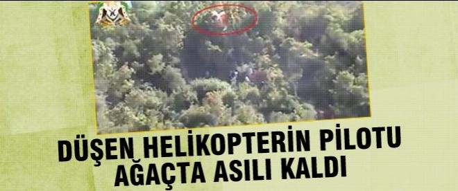 Düşen helikopterin pilotu ağaçta asılı kalmış